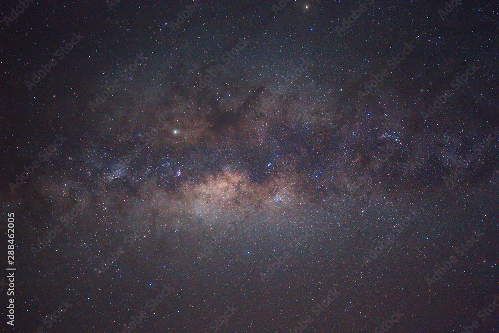 Milky Way Galaxy with billion stars at the night sky. Image contains grain, noise, blur and soft focus due to high ISO, Long Exposure and Wide Aperture.