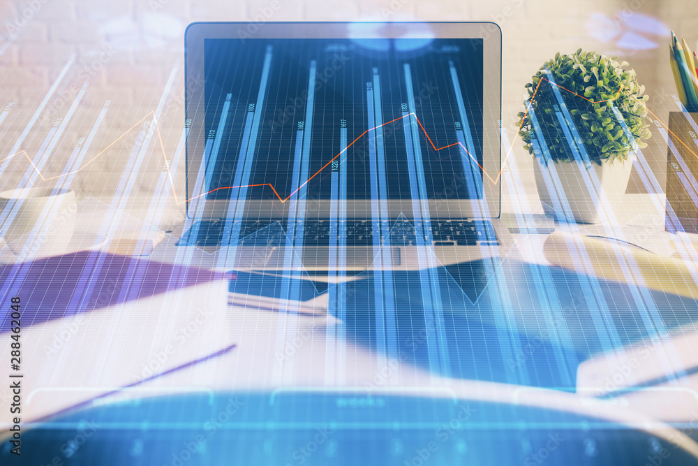 Double exposure of chart and financial info and work space with computer background. Concept of international online trading. Double exposure of chart and financial info and work space with computer background. Concept of international online trading.