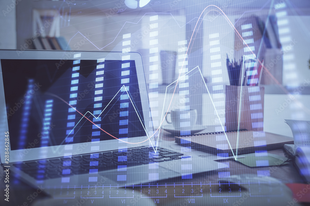 Forex market chart hologram and personal computer background. Multi exposure. Concept of investment. Forex market chart hologram and personal computer background. Multi exposure. Concept of investment.