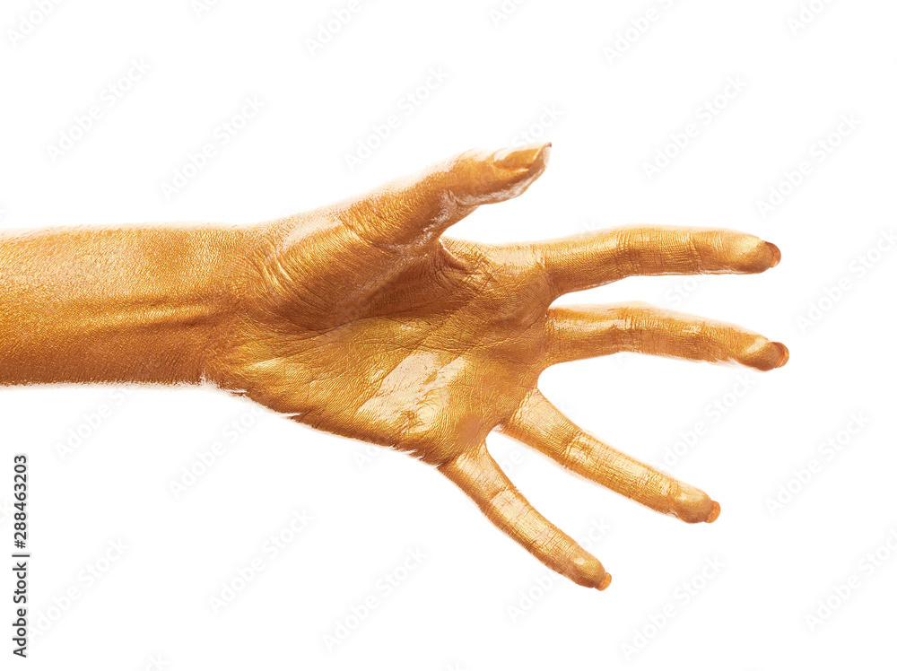 Hands in gold paint. Golden fingers. Female hand isolated on white background. White women's relaxed hand showing symbols and gestures. Hands in gold paint. Golden fingers. Female hand isolated on white background. White women's relaxed hand showing symbols and gestures.