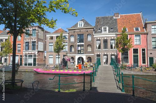Typical old colorful Dutch houses on a canal on a sunny day. World water day.