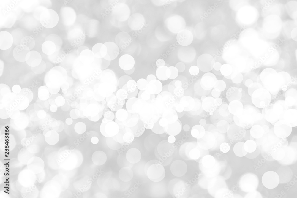 Abstract background with White bokeh on gray background. christmas blurred beautiful shiny Christmas lights. Abstract background with White bokeh on gray background. christmas blurred beautiful shiny Christmas lights.