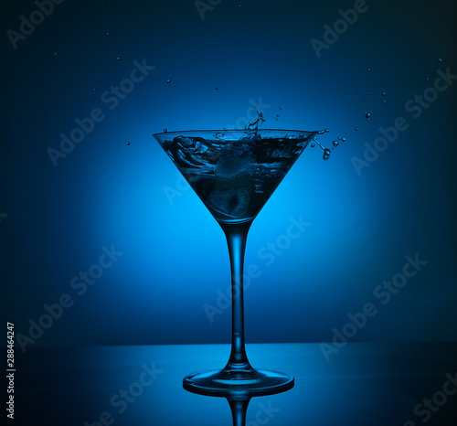 blue martini cocktail with water splash