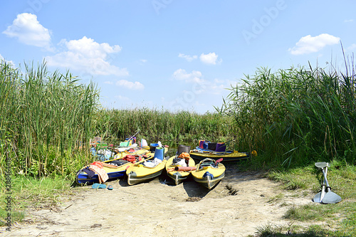 Wallpaper Mural Kayaks on the river bank during the afternoon rest. Torontodigital.ca
