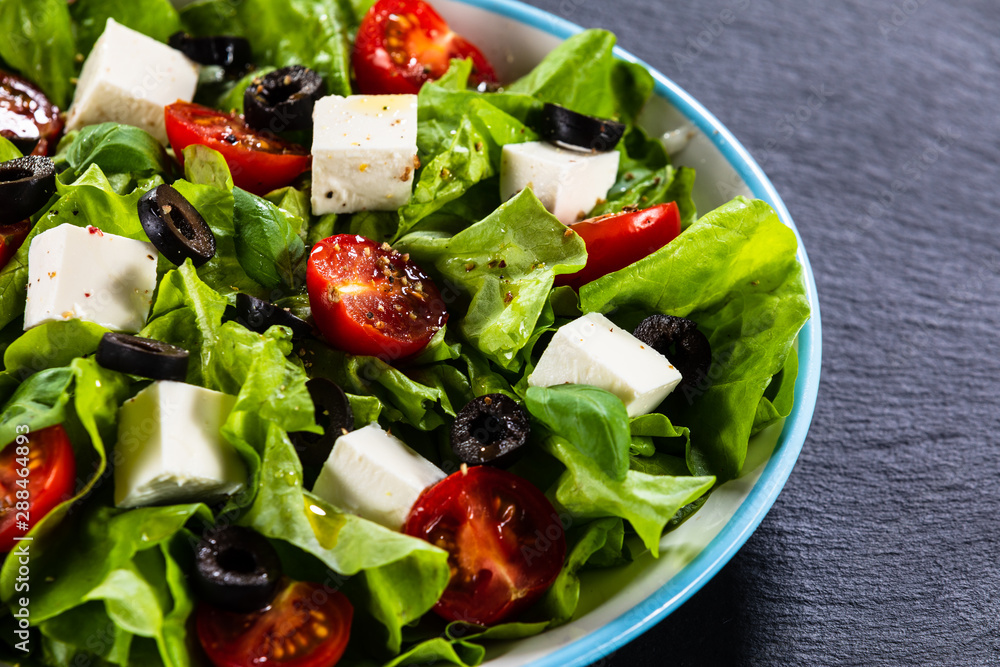 Greek salad on stone background