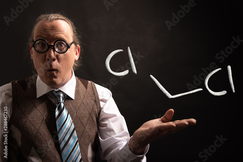 Professor presenting handdrawn chemical formula of dichloromethane