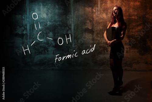 Принти на полотні Sexy girl or secretary or female student presenting handdrawn chemical formula o