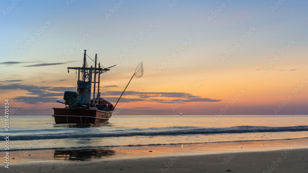 Fishing vessel with sea ocean in sunrise time.