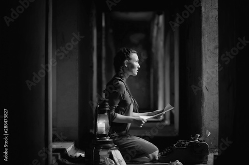 Retro girl in the old house reading books © alexkich