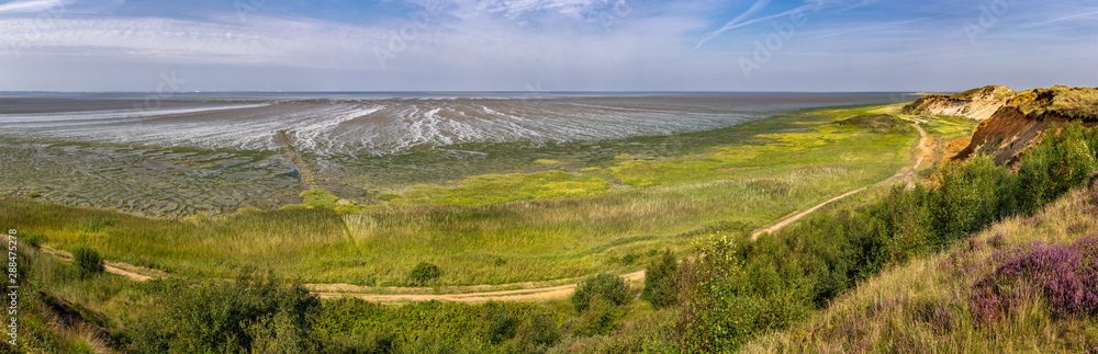 Island of Sylt, Germany. The coast and Wadden Sea at the Cliff of Morsum. panoramic view. Island of Sylt, Germany. The coast and Wadden Sea at the Cliff of Morsum. panoramic view.