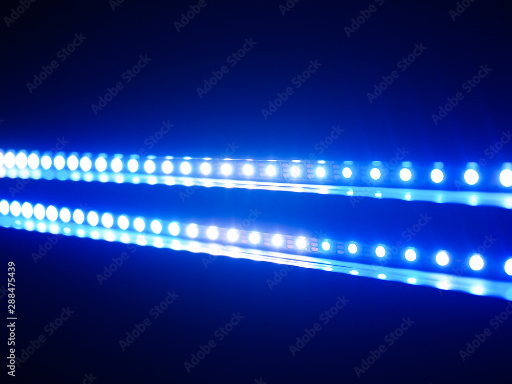 close up on blue LED light in black background