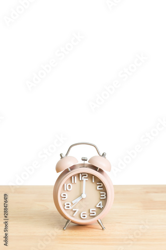 Fototapeta Naklejka Na Ścianę i Meble -  Alarm clock on table with white background.