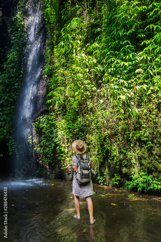 Woman near waterfal on Bali  Indonesia  