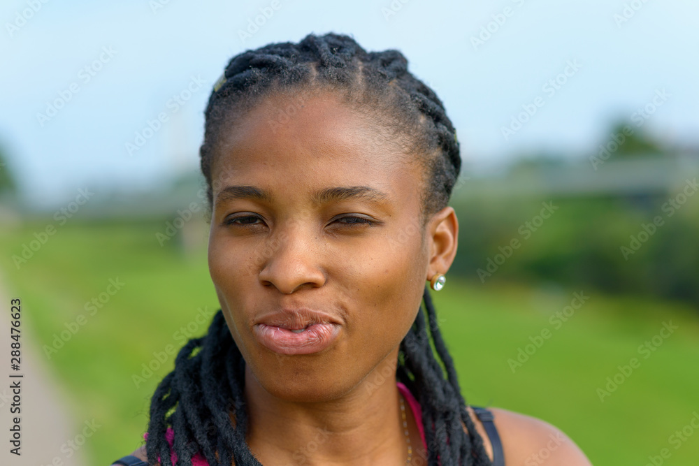 Sexy young African woman pursing her lips Sexy young African woman pursing her lips