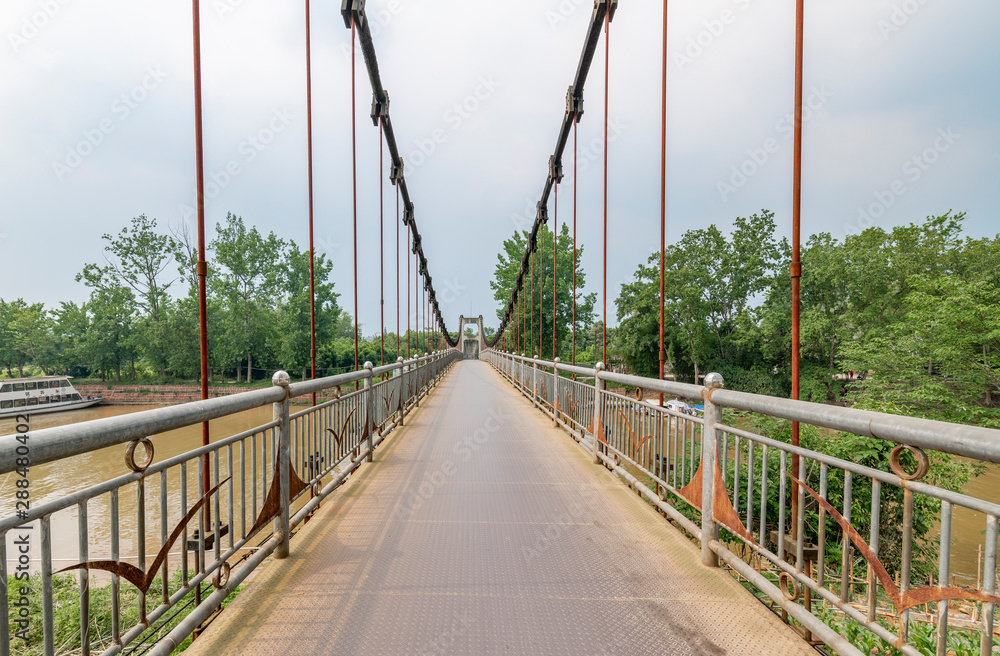 Obraz premium Iron rope suspension bridge in the ancient town of Huanglongxi, Chengdu, Sichuan Province, China