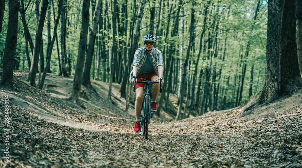 Fototapeta premium Men is riding on bicycle.