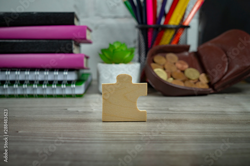 Wooden puzzle piece standing on end