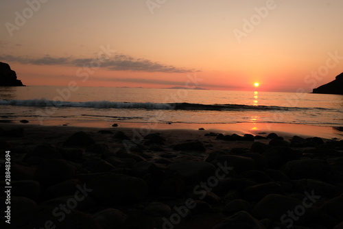 sunset on beach © Nareerasa