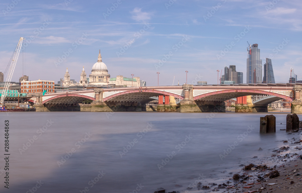 London, UK - View of the River Thames, Blackfriars Bridge, Saint Paul's Cathedral and London Skyscrapers