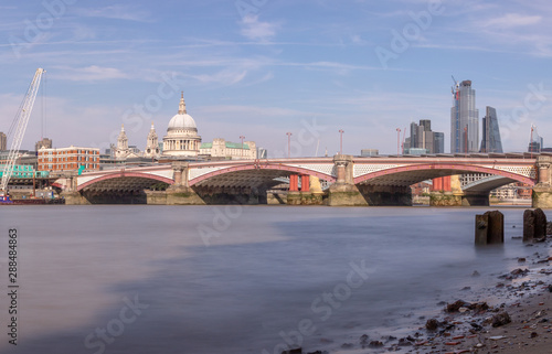 Fototapeta Naklejka Na Ścianę i Meble -  London, UK - View of the River Thames, Blackfriars Bridge, Saint Paul's Cathedral and London Skyscrapers