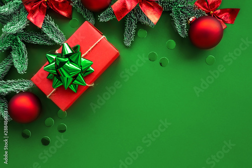 Christmas composition.  Background with gift box and decorations.