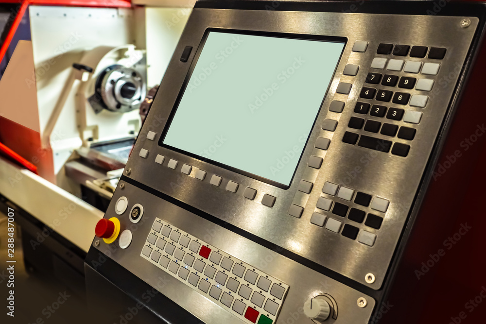 CNC equipment. The control panel of the machine. Computer management in industry. Modern turning equipment. Milling machine control. CNC programmer. Metal processing. Robotization of factories.