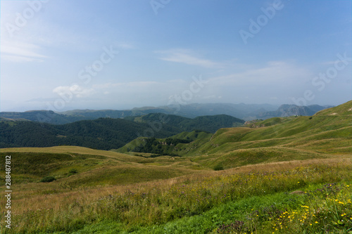 Gumbashi pass view in the russian caucasus  green meadow landscape at an altitude of above 2000 m