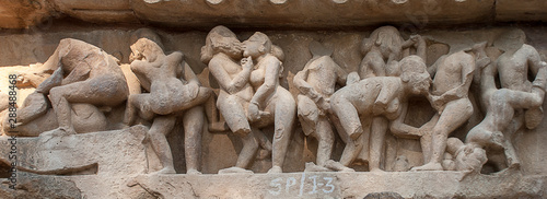 Obraz na płótnie Erotic sculptures on the walls of famous Khajuraho Temples in India. Khajuraho Temples are one of the UNESCO World Heritage Sites in India. The temples are famous for their Nagara-style architectural w salonie