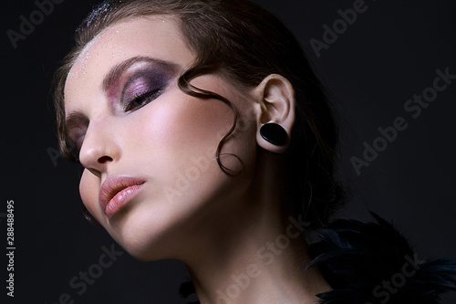 Gothic girl. Halloween Makeup. Luxury beautiful woman with gothic makeup. Beauty stylish girl with closed eyes