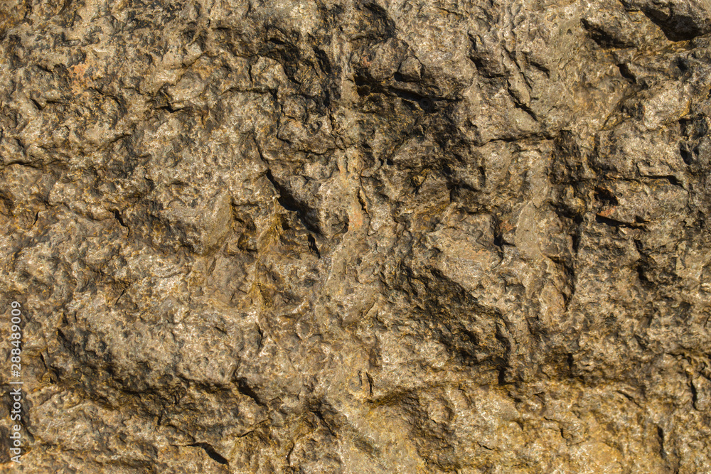 Rock plate. Colored stone surface. Wall of the house. Geology and Metamorphic rocks. Rock plate. Colored stone surface. Wall of the house. Geology and Metamorphic rocks.