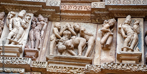 Erotic sculptures on the walls of famous Khajuraho Temples in India. Khajuraho Temples are one of the UNESCO World Heritage Sites in India. The temples are famous for their Nagara-style architectural 