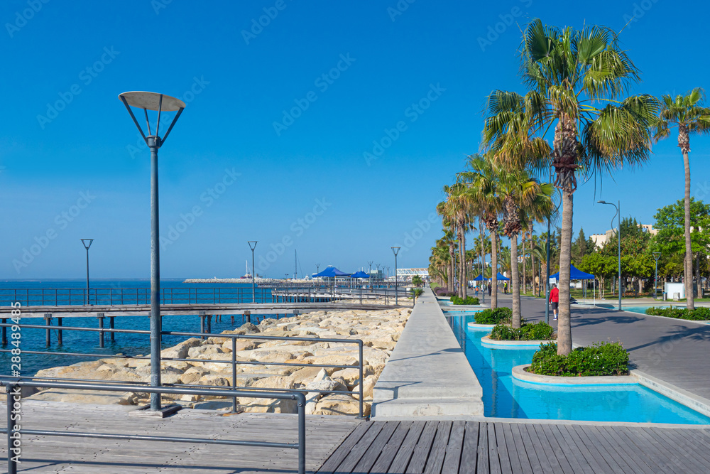 Cyprus. Limassol embankment on a Sunny day.Walking area near the Mediterranean sea. Tourist part of Limassol. Walking along the waterfront. Types Of Cyprus. Rest on the Mediterranean.