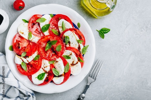 Tomato, basil, mozzarella Caprese salad with balsamic vinegar and olive oil.