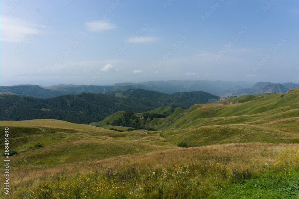 Gumbashi pass view in the russian caucasus, green meadow landscape at an altitude of above 2000 m Gumbashi pass view in the russian caucasus, green meadow landscape at an altitude of above 2000 m