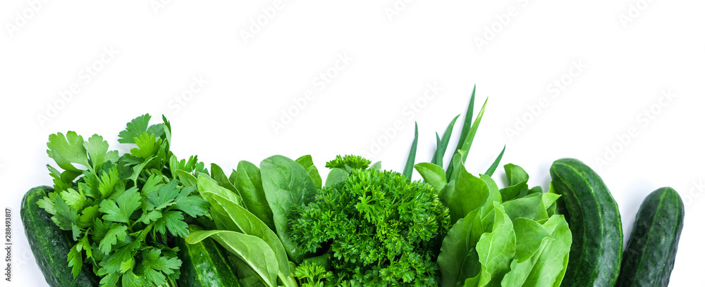 Wall murals fresh green vegetables and herbs border on white background -  