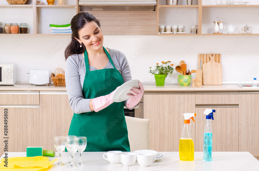 Young female contractor doing housework Young female contractor doing housework