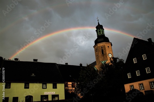 Imposanter Regenbogen über der Stadtkirche zu Geising photo