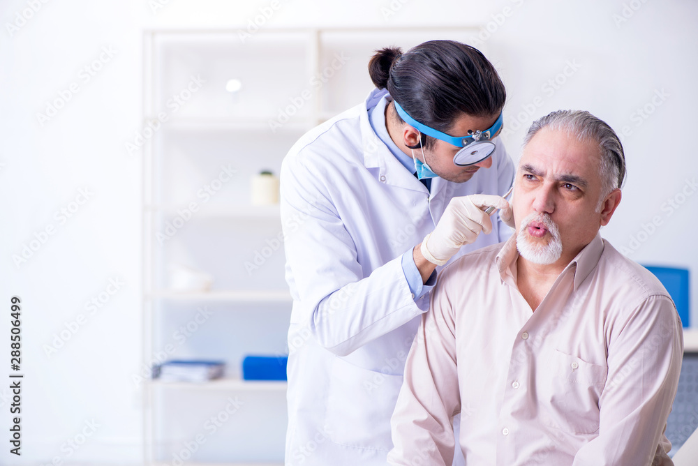Fototapeta premium Male patient visiting doctor otolaryngologist