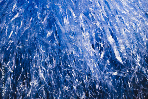 Abstract blue texture with wavy plastic stripes