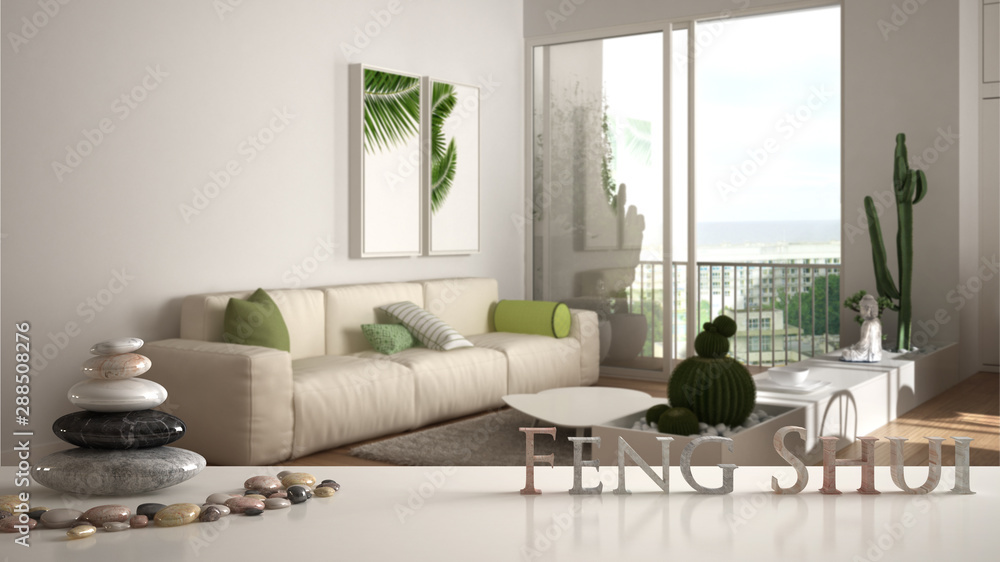 White table shelf with pebble balance and 3d letters making the word feng shui over modern living room with sofa in contemporary apartment, zen concept interior design White table shelf with pebble balance and 3d letters making the word feng shui over modern living room with sofa in contemporary apartment, zen concept interior design