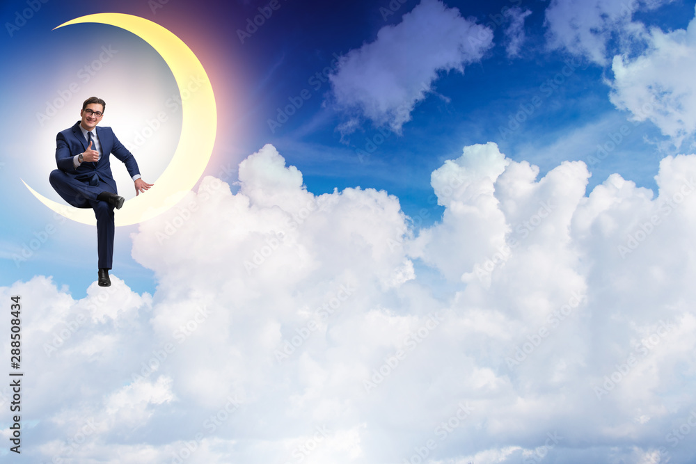 Businessman sitting on the crescent moon Businessman sitting on the crescent moon