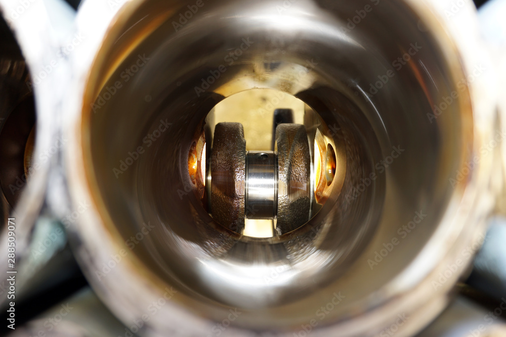 Unusual view of the crankshaft. View from the cylinder. Unusual view of the crankshaft. View from the cylinder.