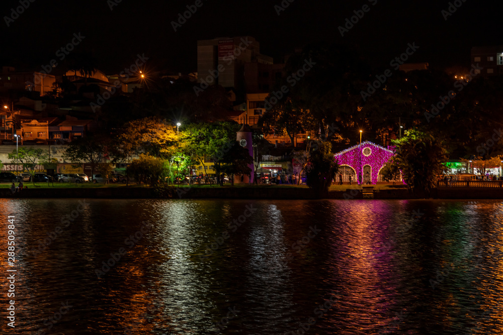 Christmas decoration lights reflected in lake at climate resort in Bragança Paulista region of lakes in Sao Paulo Brazil Christmas decoration lights reflected in lake at climate resort in Bragança Paulista region of lakes in Sao Paulo Brazil