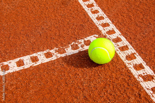 One tennis ball on tennis court with a line © Friedemann Blümel
