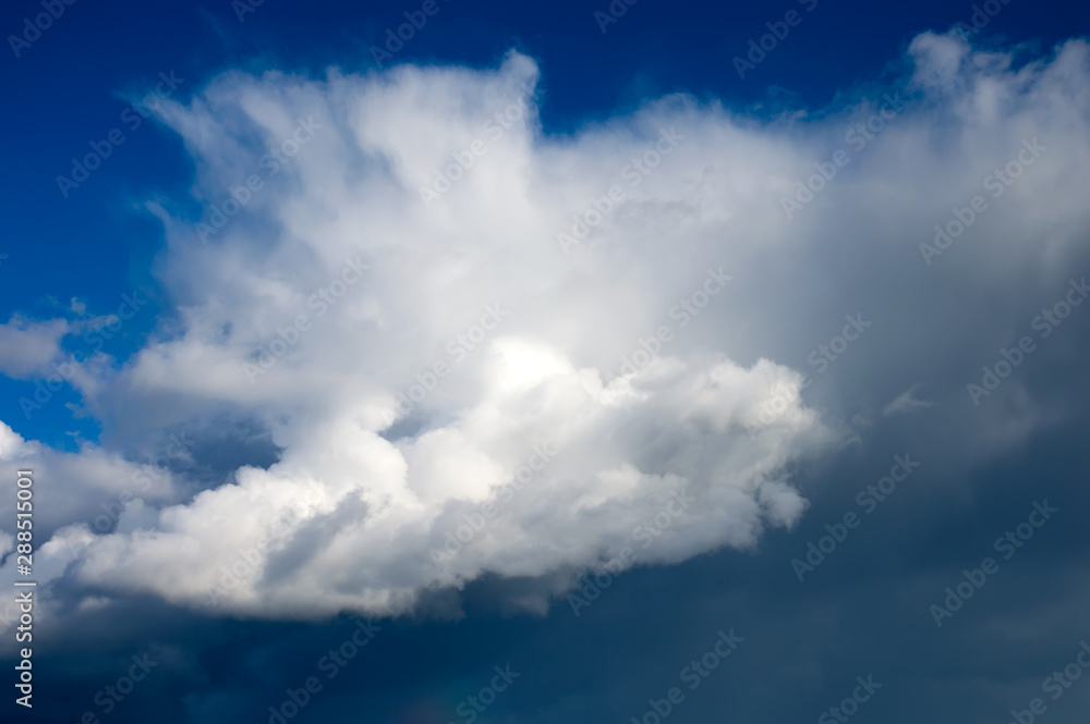 The sky is blue with heap clouds. Atmosphere. Sky background.