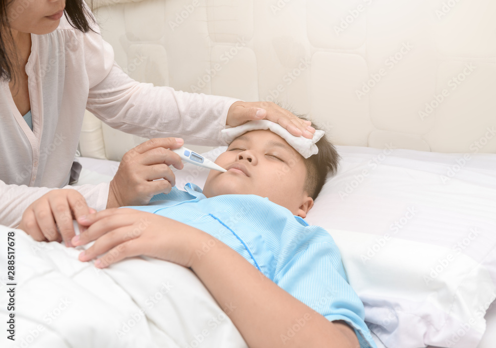 Fototapeta premium Mother measuring temperature of ill kid.