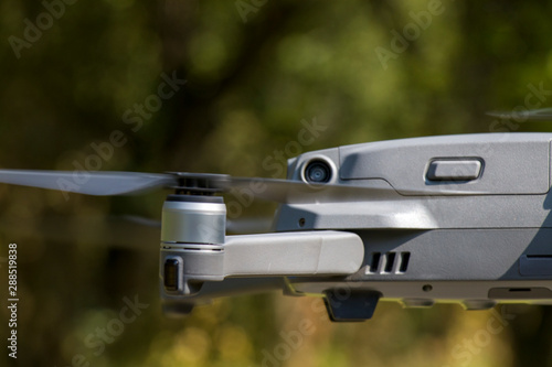DJI Mavic 2 Pro drone midflight featuring a camera a major camera upgrade over the previous Mavic model. Blue sky backgorund