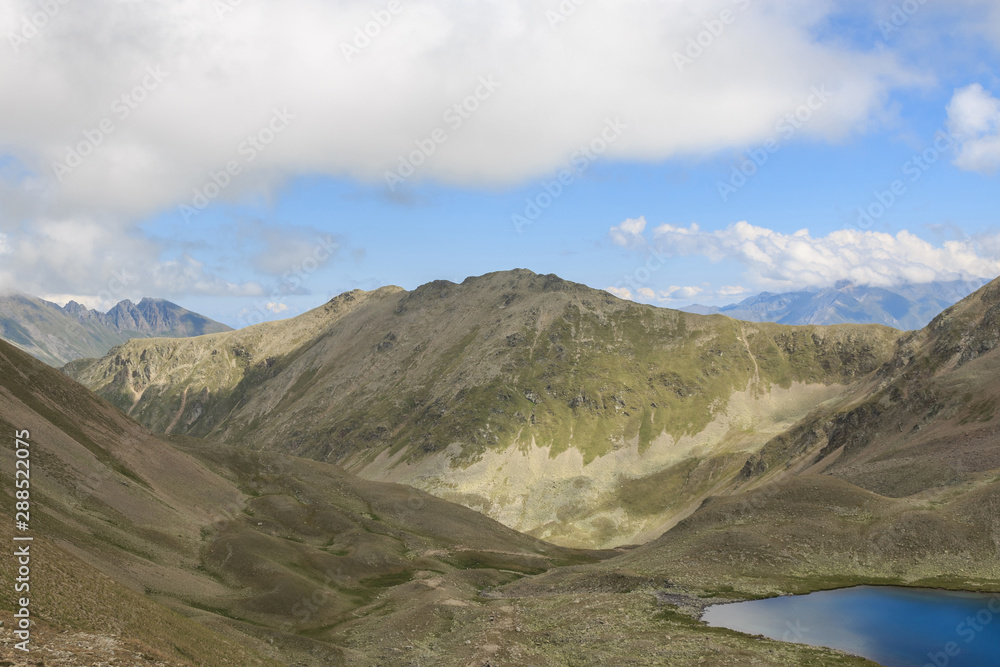 Panorama of lake scenes in mountains, national park Dombay, Caucasus