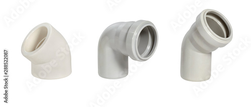 Assorted PVC sewage pipe fittings shot on white