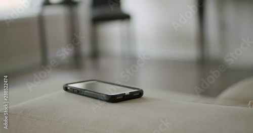 Wallpaper Mural Phone Sitting on Couch then Lights Up from Text Message Torontodigital.ca